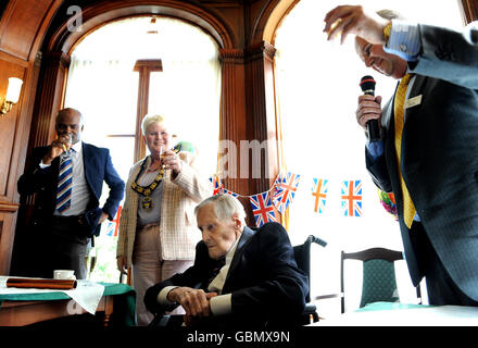 Britain's oldest Olympian Godfrey Rampling celebrates his 100th Birthday during a party at Bushey House, Bushey. Stock Photo