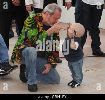 Terry Gilliam and Verne Troyer (right) attend a photocall for the film The Imaginarium of Doctor Parnassus at the Palais de Festival in Cannes, during the 62nd Cannes Film Festival, France. Stock Photo