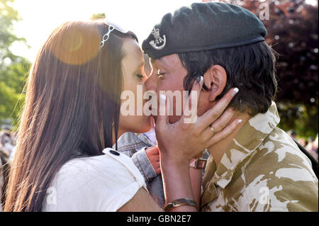 An unidentified soldier kisses a woman as the 1st Battalion The Rifles return from Afghanistan to Beachley barracks, Chepstow. Stock Photo
