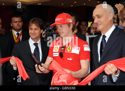 Kimi Raikkonen cuts the ribbon to open the Ferrari Store on Regent Street, central London. Stock Photo
