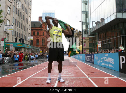 Jamaica's Usain Bolt celebrates winning the 150m Event on a specially constructed track during the BUPA Great Manchester Run and Great City Games, in Manchester. Stock Photo