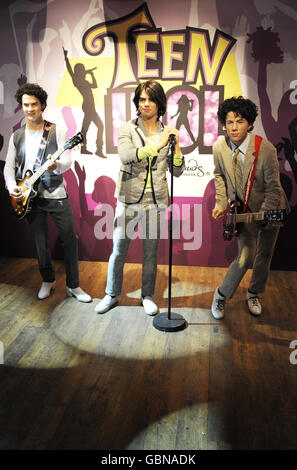 Wax models of the Jonas brothers (left to right) Nick, Joe and Kevin unveiled today at Madame Tussauds in central London. Stock Photo