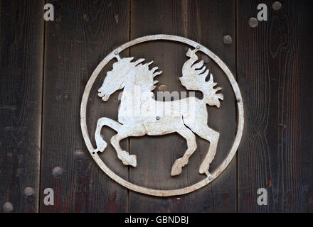 KOPRIVSHTITSA, BULGARIA - NOVEMBER 23, 2014: Nice symbol of a horse on an old door in Koprivshtitsa, Bulgaria Stock Photo