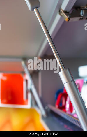 open kitchen shelf with colorful dishes, closeup Stock Photo