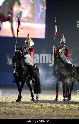 The Household Cavalry Musical Ride perform in the Windsor Castle Royal Tattoo in the grounds of the Castle in Berkshire. Stock Photo