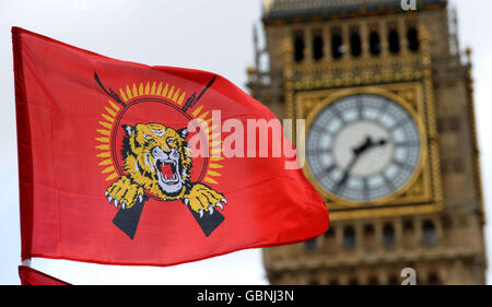 A Tamil Tiger flag flies in front of the Houses of Parliament as Tamil supporters demonstrate on Parliament Square, following news that the leader of Sri Lanka's rebel Tamil Tigers was killed by army troops today, crushing their final resistance. Stock Photo