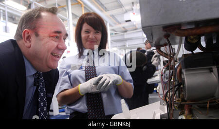 First Minister Alex Salmond (left) with Scottish Gas apprentice of the Year Julie McHugh, during a visit to opens a Scottish Gas training centre in Hamilton near Glasgow, ahead opening Europe's biggest onshore windfarm. Stock Photo