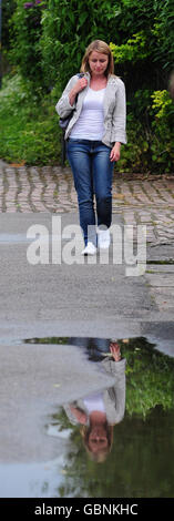 An actress is filmed walking down Melrosegate in York during the filming of a reconstruction for BBC programme Crimewatch reconstructing the last known movements of missing York University chef Claudia Lawrence in York. Stock Photo