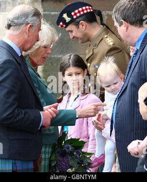 Prince Charles, Duke of Rothesay (left) and Camilla Duchess of Cornwall, Duchess of Rothesay (centre) meet one year old Katie MacPherson, watched by mum Janette from Drumnadrochit during a visit to visit The Black Watch, 3rd Battalion The Royal Regiment of Scotland, Fort George, Inverness. Stock Photo