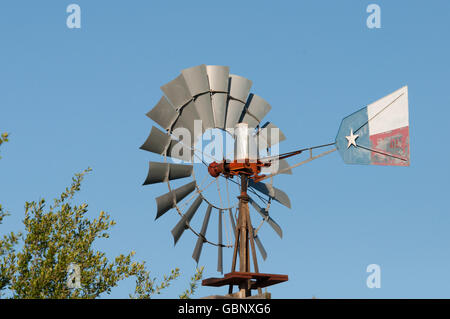 Windmill with Texas flag painted on wind vane Stock Photo