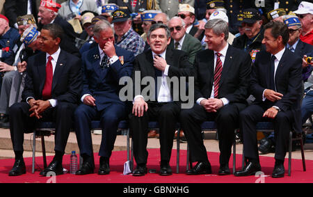 (Left to right) US President Barack Obama, the Prince of Wales, British Prime Minister Gordon Brown, Canadian Prime Minister Stephen Harper and France's President Nicolas Sarkozy attend a memorial service at the American Cemetery in Colleville-sur-Mer, Normandy, France, on the 65th anniversary of the D-Day landings. Stock Photo