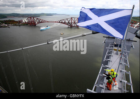 A view from the top of the Forth Road Bridge of Norfolkline's boat SCOTTISH VIKING between the Forth Road and Rail Bridges on the River Forth on its maiden voyage from Zeebrugge to Rosyth at the launch of a new ferry route. Stock Photo