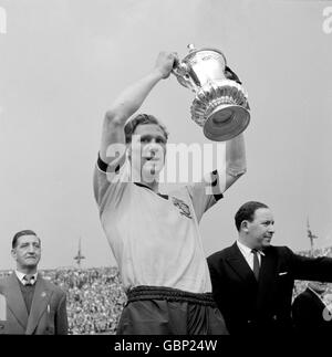 Wolverhampton Wanderers captain Bill Slater shows off the FA Cup after his team's 3-0 win Stock Photo