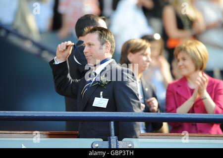 John Gowans whose son Craig, a youth team player with Falkirk, died after a training ground incident in 2005 collects a runners up medal after the final whistle Stock Photo