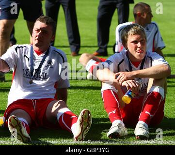 Falkirk's Thomas Scobbie (left) and Scott Arfield (right) appear dejected after the final whistle. Stock Photo