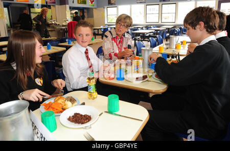 Celebrity chef Prue Leith (centre right) with pupils from Howden School, East Yorkshire, during a visit to meet catering staff and pupils at the school. Stock Photo