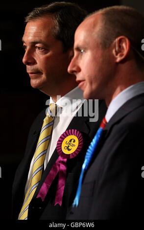 Leader of the United Kingdom Independence Party (UKIP) Nigel Farage MEP (left) and Conservative MEP Daniel Hannan speak to television crews following their election as MEPs at the results for the European Parliamentary Election in the south east, at Saint Mary's Stadium, Southampton. Stock Photo