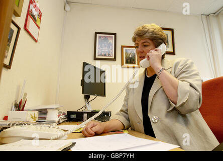 Labour MP Jane Kennedy gives a phone interview inside her constituency office in the Wavertree area of Liverpool after leaving her post as Environment Minister. Stock Photo