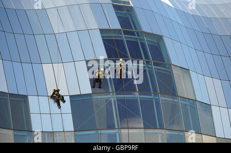 Window cleaners up high cleaning the Sage Music Centre in Gateshead, Newcastle, today. Stock Photo
