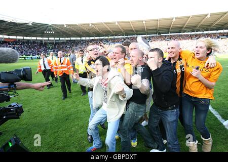 Soccer - Barclays Premier League - Hull City v Manchester United - KC Stadium. Hull City fans celebrate after their team stay in the Premier League Stock Photo