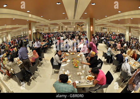 (160707) -- BANDAR SERI BEGAWAN, July 7, 2016 (Xinhua) -- Bruneians and foreigners in Brunei enjoy free buffet during Hari Raya Aidil Fitri open house celebration at the Istana Nurul Iman palace in Bandar Seri Begawan, Brunei, July 7, 2016. The Istana Nurul Iman palace, the residence of Brunei's Sultan Haji Hassanal Bolkiah, opens to the public from July 7 to July 9. The Sultan, along with other members of the royal family, will celebrate the annual Muslim festival of Hari Raya Aidil Fitri with Bruneians and foreigners at the palace, providing every visitor with free buffet and souvenirs. Thou Stock Photo