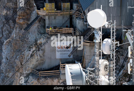 Garmisch-Partenkirchen, Germany. 07th June, 2016. The construction site for the new cable car can be seen on Zugspitze peak in Garmisch-Partenkirchen, Germany, 07 June 2016. The successor to the cable car that opened in 1963 on Germany's highest peak (2,962 meters) will ride parallel to the existing train path and will open on 21 December 2017. Photo: Sven Hoppe/dpa/Alamy Live News Stock Photo