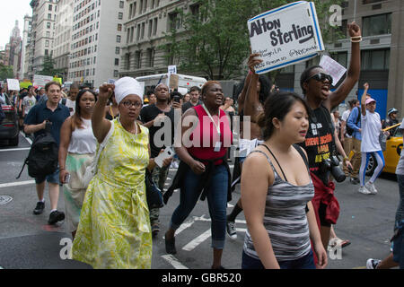 New York, USA. 7th July 2016. Protesters march up Fifth Avenue toward midtown.  Hundreds rallied in Union Square, then marched through midtown Manhattan condemning the shooting deaths of two black men, Philando Castile in Minnesota and Alton Sterling in Baton Rouge, within a day of each other this week. Credit:  M. Stan Reaves/Alamy Live News Stock Photo
