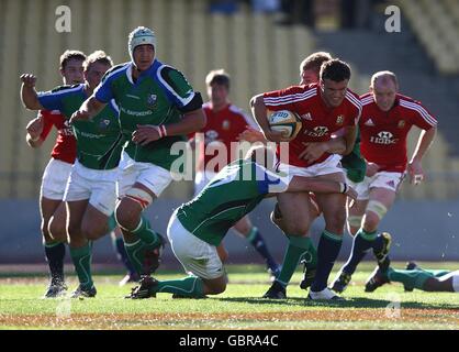 Rugby Union - Tour Match - Royal Highveld XV v British and Irish Lions - Royal Bafokeng Sports Palace. British and Irish Lions' Jamie Roberts powers past a tackle from Royal Highveld XV's Sarel Pretorius Stock Photo