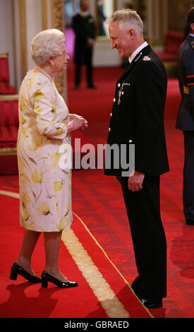 Mr. Stephen Otter, Chief Constable, Devon and Cornwall Constabulary, is decorated with The Queen's Police Medal by Queen Elizabeth II at Buckingham Palace. Stock Photo