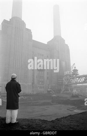 Two of the famous chimneys at Battersea Power Station - a familiar Sout London landmark - are seen today without the familiar white smoke, usually seen belching out at all times of day. Stock Photo