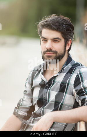 Portrait of an attractive young woman posing outdoors. Stock Photo