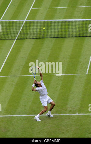 Serbia's Novak Djokovic in action during the 2009 Wimbledon Championships at the All England Lawn Tennis and Croquet Club, Wimbledon, London. Stock Photo