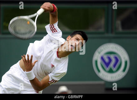 Serbia's Novak Djokovic in action against France's Julien Benneteau Stock Photo