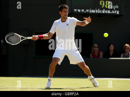 Serbia's Novak Djokovic in action against Germany's Simon Greul during the 2009 Wimbledon Championships at the All England Lawn Tennis and Croquet Club, Wimbledon, London. Stock Photo