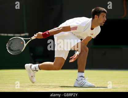 Serbia's Novak Djokovic in action against Germany's Simon Greul during the 2009 Wimbledon Championships at the All England Lawn Tennis and Croquet Club, Wimbledon, London. Stock Photo