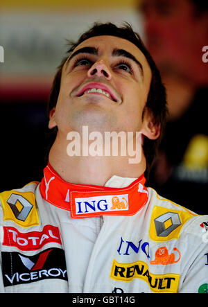 Motor Racing - Formula One World Championship - British Grand Prix - Qualifying &#8211; Silverstone. Renault's Fernando Alonso of Spain looks on in the pits during qualifying at Silverstone, Northamptonshire. Stock Photo