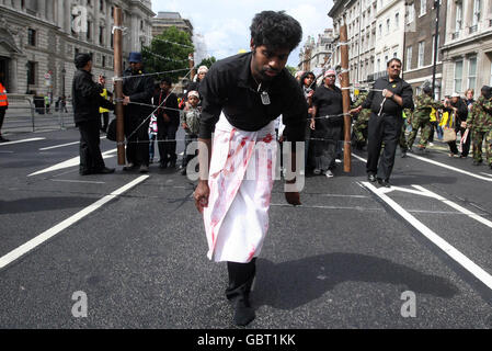 Pro-Tamil protesters in a mock-up Second World War concentration camp as the campaigners compared the plight in Sri Lanka to Nazi Germany in Westminster, central London. Stock Photo