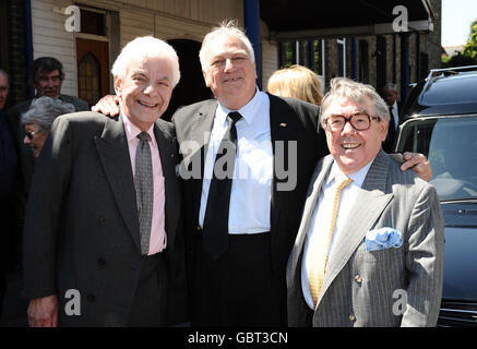 (Left - right) Barry Cryer, Roy Hudd and Ronnie Corbett leave the funeral of Danny La Rue at the Church of the Transfiguration in Kensal Rise, London. Stock Photo