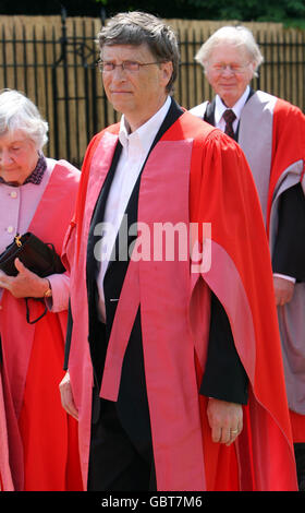 Bill Gates, founder of The Microsoft Corporation, walks in a procession at the Senate House at Cambridge University, before being made an honorary Doctor of Law during a ceremony at the University. Gates broke with tradition when he collected his degree in an open-necked shirt. Stock Photo