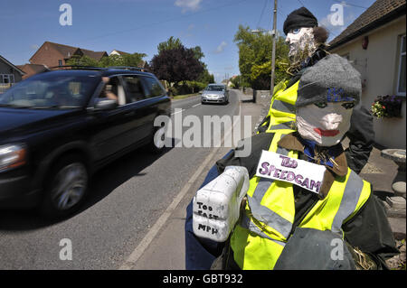 Speed camera scarecrows. Ted and Barry the speed camera scarecrows in Glastonbury Road in Meare, Somerset. Stock Photo