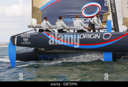 Triple Olympic gold medallist Ben Ainslie gets to grips with the Team Origin Extreme 40 catamaran on the Solent near Cowes, Isle of Wight. Stock Photo