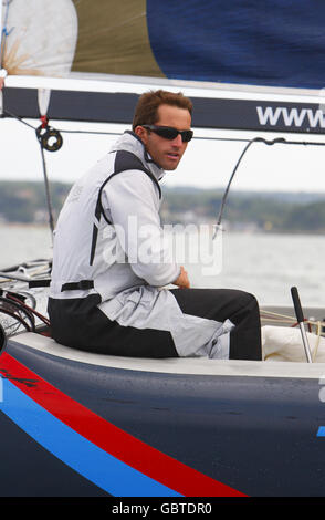 Sailing - Round The Island Preview - Ben Ainslie Photocall - Island Sailing Club. Triple Olympic gold medallist Ben Ainslie gets to grips with the Team Origin Extreme 40 catamaran on the Solent near Cowes, Isle of Wight. Stock Photo