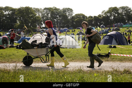 Festival goers in a camping area the day before the Glastonbury Festival starts at Worthy Farm in Somerset. Stock Photo