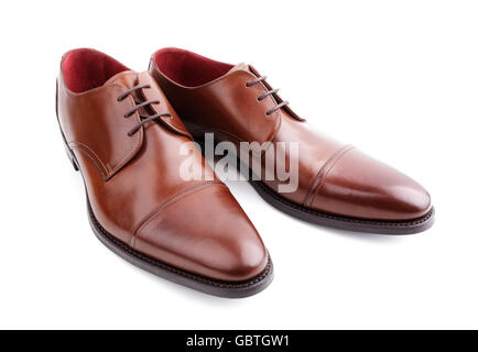 Classic brown mans handcrafted leather shoes isolated on white Stock Photo