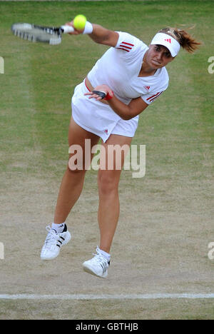 Germany's Sabine Lisicki in action against Russia's Svetlana Kuznetsova during the 2009 Wimbledon Championships at the All England Lawn Tennis and Croquet Club, Wimbledon, London. Stock Photo