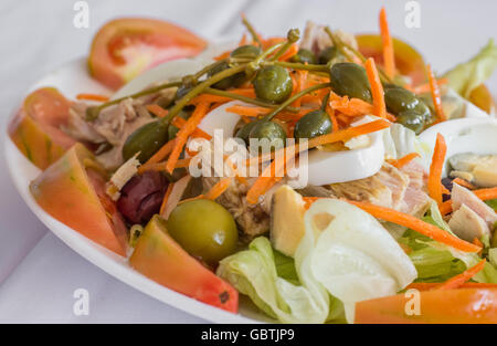 Traditional spanish, valencian salad with eggs, large capers, tuna and tomatoes Stock Photo