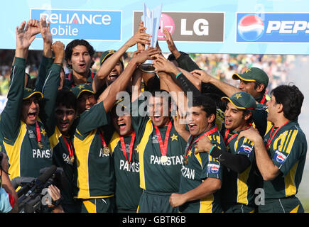 Pakistan's captain Younis Khan lifts trophy and celebrates with teammates after victory over Sri Lanka during the Final of the ICC World Twenty20 at Lords, London. Stock Photo