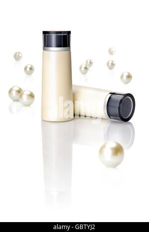 Two blank cosmetic bottles on a table. Stock Photo