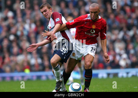 Soccer - FA Barclays Premiership - Manchester United v Middlesbrough. Manchester United's Mikael Silvestre (r) and Middlesbrough's James Morrison (l) battle for the ball Stock Photo