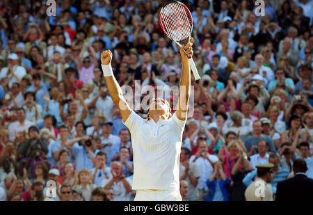 Switzerland's Roger Federer celebrates his victory during the Wimbledon Championships at the All England Lawn Tennis and Croquet Club, Wimbledon, London. Stock Photo